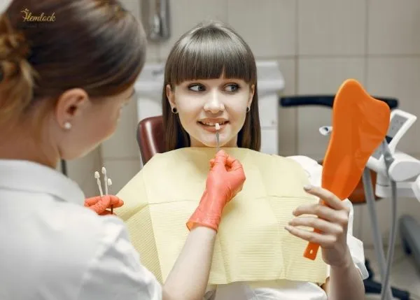 How Much Are Veneers in BC? Complete 2025 Guide to Costs, Types & Insurance Coverage 1 Woman smiling during veneer shade selection at dental clinic — how much are veneers in BC
