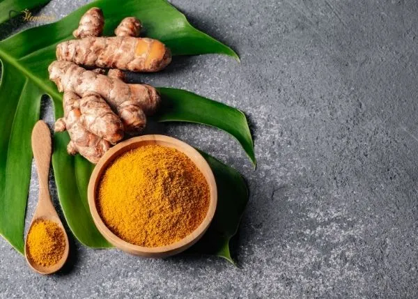 Can Turmeric Powder Whiten Teeth? 1 Turmeric powder and toothbrush for natural oral care – can turmeric powder whiten teeth