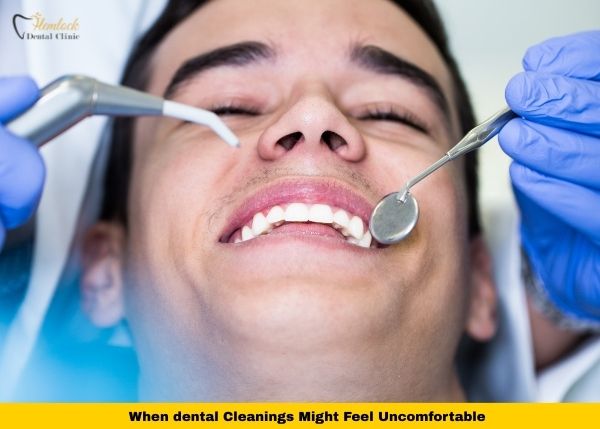 Do Dental Cleanings Hurt? A Complete Guide 1 Do dental cleanings hurt? Patient receiving a routine dental cleaning with mirror and water syringe