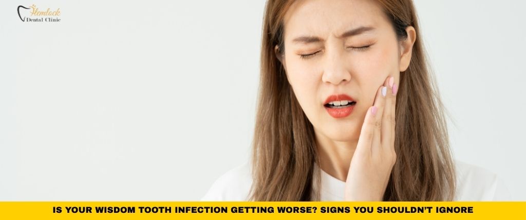 Dental Clinic Blog 1 Person holding swollen jaw in pain showing symptoms of wisdom tooth infection and worsening wisdom tooth infection signs