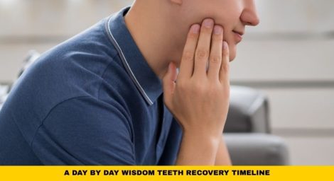 Person holding jaw during healing after extraction for a day by day wisdom teeth recovery timeline